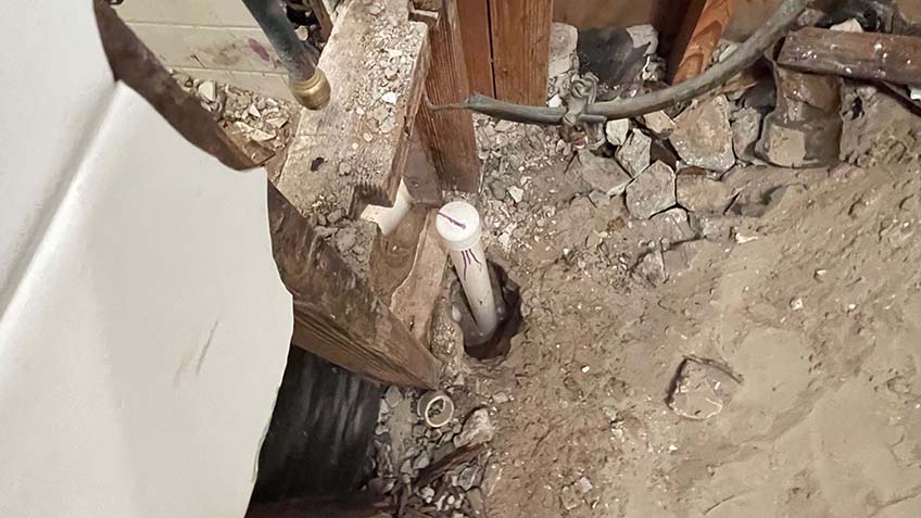 Damaged pipe being repaired
